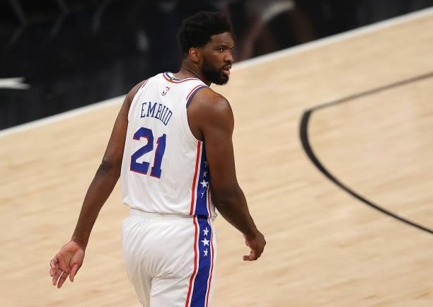 Joel Embiid of the Philadelphia 76ers reacts after throwing the ball away against the Atlanta Hawks during the first half of game 6 of the Eastern...