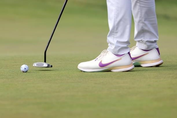 Detailed view of a golf ball and shoes belonging to Matthew Wolff of the United States are seen as he putts on the 14th green during the second round...