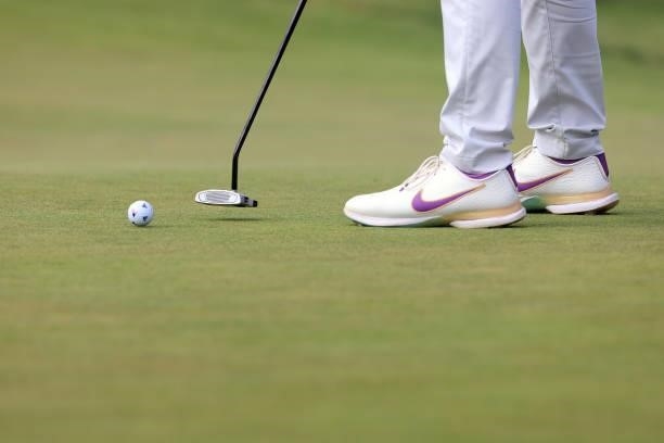 Detailed view of a golf ball and shoes belonging to Matthew Wolff of the United States are seen as he putts on the 14th green during the second round...