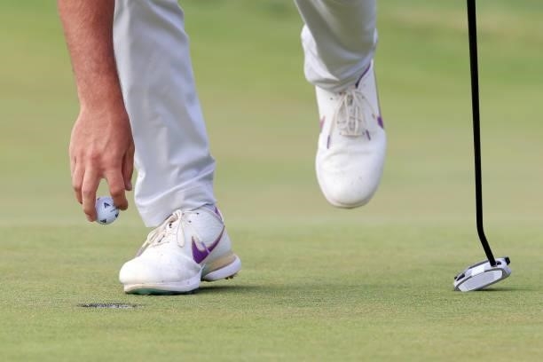 Detailed view of a golf ball and shoes belonging to Matthew Wolff of the United States are seen on the 14th green during the second round of the 2021...