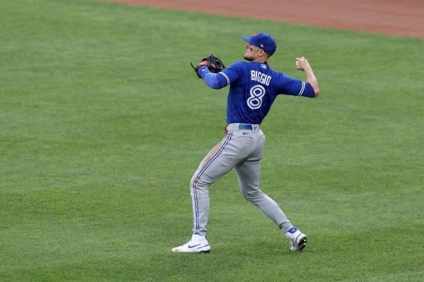 Cavan Biggio of the Toronto Blue Jays throws the ball in against the Baltimore Orioles at Oriole Park at Camden Yards on June 18, 2021 in Baltimore,...
