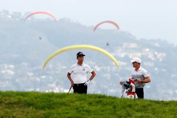 Kevin Na of the United States waits with caddie Kenny Harms on the fourth fairway during the second round of the 2021 U.S. Open at Torrey Pines Golf...