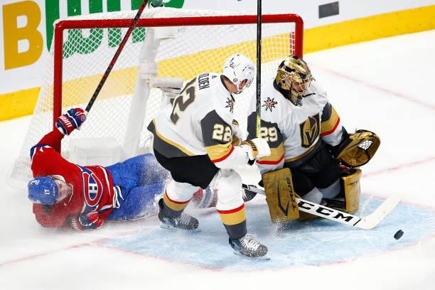 Josh Anderson of the Montreal Canadiens crashes into the net as Marc-Andre Fleury of the Vegas Golden Knights makes the save during the first period...