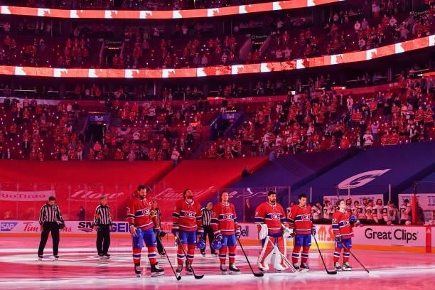 The Montreal Canadiens stand for the national anthem prior to Game Three of the Stanley Cup Semifinals of the 2021 Stanley Cup Playoffs against the...