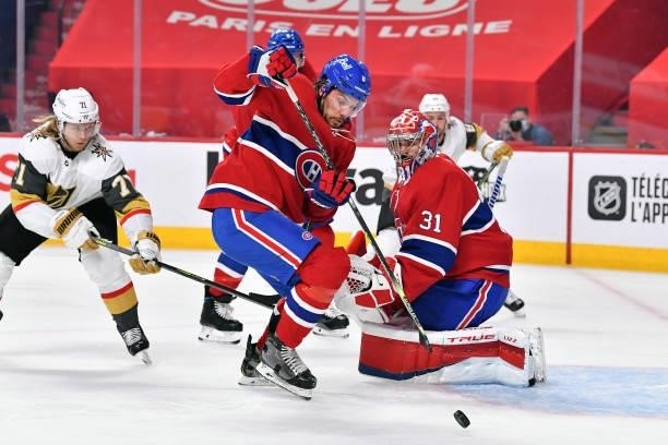 Ben Chiarot of the Montreal Canadiens gathers the puck in front of Carey Price against the Vegas Golden Knights during the first period in Game Three...