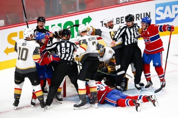 The Montreal Canadiens and Vegas Golden Knights mix it up during the first period in Game Three of the Stanley Cup Semifinals of the 2021 Stanley Cup...