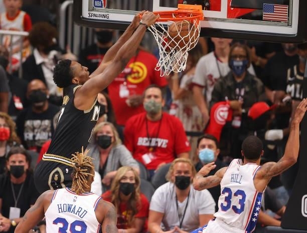 Onyeka Okongwu of the Atlanta Hawks dunks against Dwight Howard and George Hill of the Philadelphia 76ers during the first half of game 6 of the...