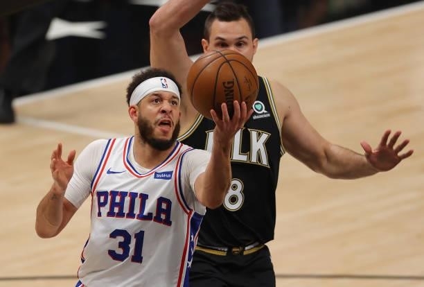 Seth Curry of the Philadelphia 76ers drives against Danilo Gallinari of the Atlanta Hawks during the first half of game 6 of the Eastern Conference...