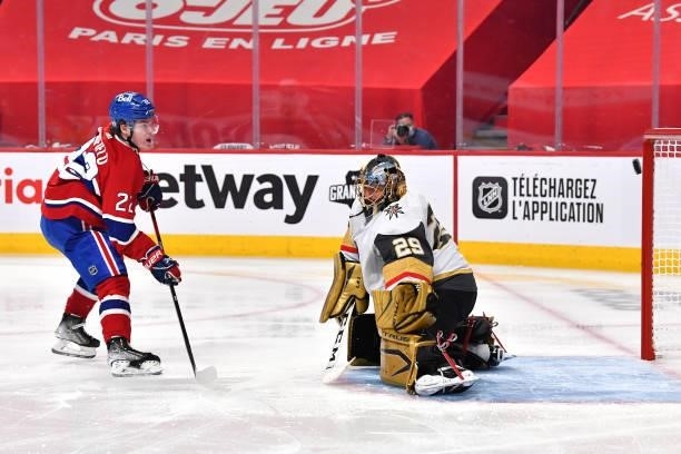 Cole Caufield of the Montreal Canadiens scores a goal past Marc-Andre Fleury of the Vegas Golden Knights during the second period in Game Three of...