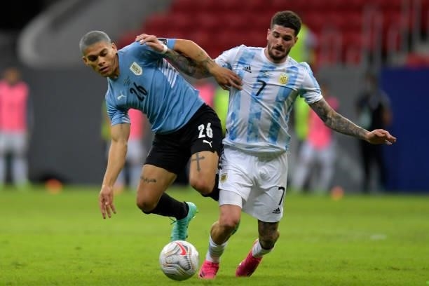 Brian Ocampo of Uruguay fights for the ball with Rodrigo De Paul of Argentina during a group A match between Argentina and Chile as part of Conmebol...