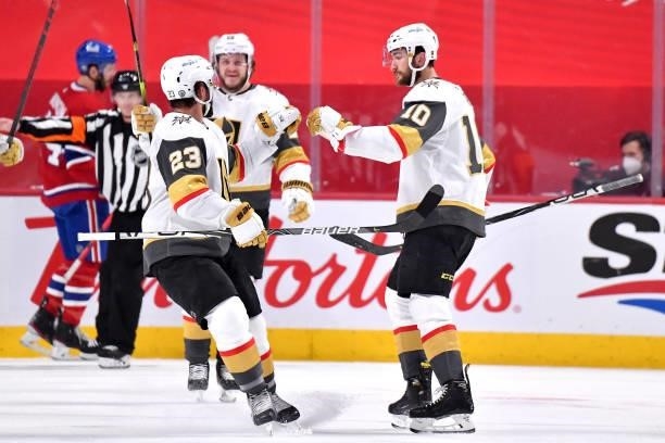 Nicolas Roy of the Vegas Golden Knights is congratulated by Alec Martinez after scoring a goal against the Montreal Canadiens during the second...