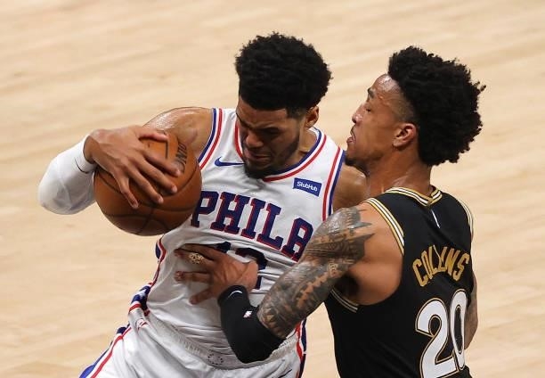 Tobias Harris of the Philadelphia 76ers drives against John Collins of the Atlanta Hawks during the first half of game 6 of the Eastern Conference...
