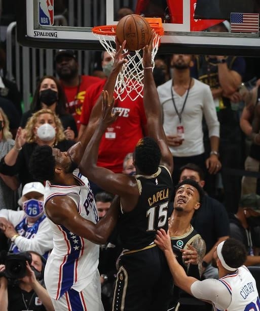 Joel Embiid of the Philadelphia 76ers blocks a shot by Clint Capela of the Atlanta Hawks during the first half of game 6 of the Eastern Conference...