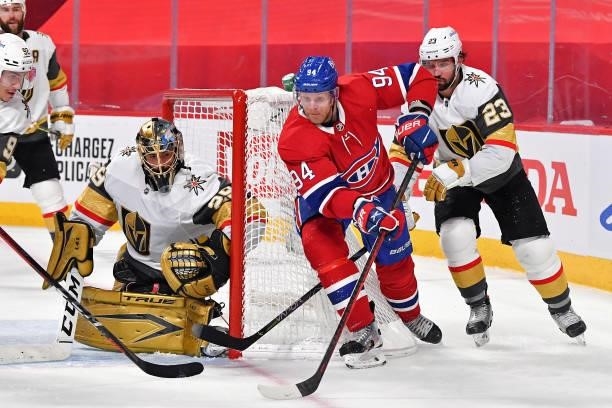 Corey Perry of the Montreal Canadiens is defended by Alec Martinez of the Vegas Golden Knights as Marc-Andre Fleury tends net during the second...