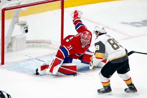 Carey Price of the Montreal Canadiens makes the save against Alex Tuch of the Vegas Golden Knights during the second period in Game Three of the...