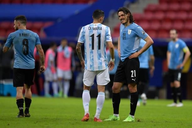 Angel Di Maria of Argentina talks to Edinson Cavani of Uruguay after a group A match between Argentina and Chile as part of Conmebol Copa America...
