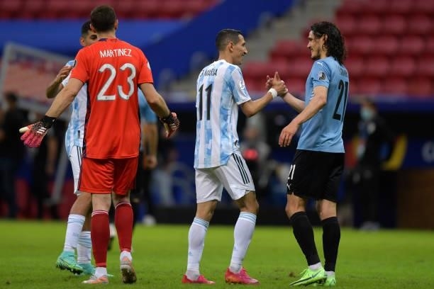 Angel Di Maria of Argentina greets Edinson Cavani of Uruguay after a group A match between Argentina and Chile as part of Conmebol Copa America...