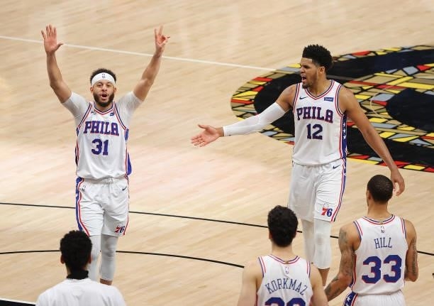 Seth Curry and Tobias Harris of the Philadelphia 76ers celebrates their 104-99 win over the Atlanta Hawks in game 6 of the Eastern Conference...