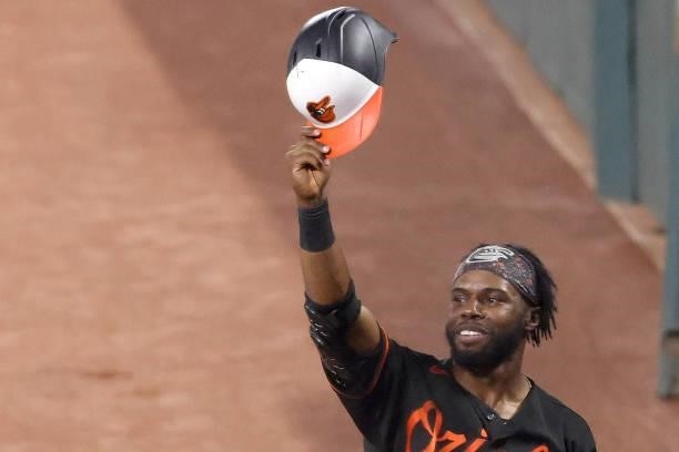 Cedric Mullins of the Baltimore Orioles comes out of the dugout to acknowledge the crowd after hitting a three RBI home run against the Toronto Blue...