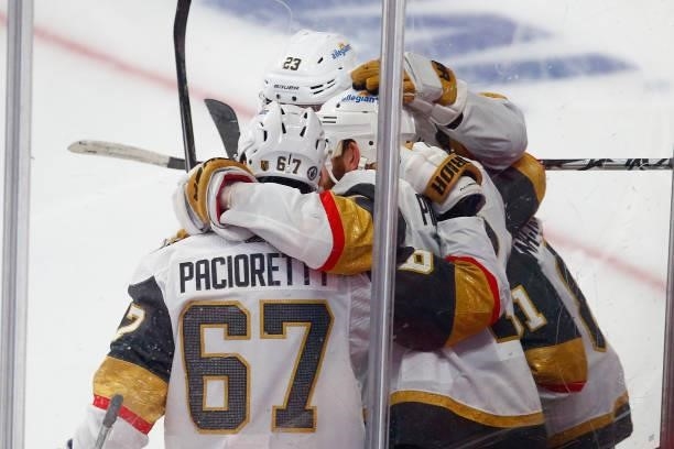 Alex Pietrangelo of the Vegas Golden Knights is congratulated by his teammates after scoring a goal against the Montreal Canadiens during the third...