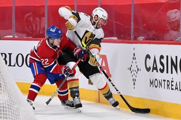 Brayden McNabb of the Vegas Golden Knights is defended by Cole Caufield of the Montreal Canadiens during the third period in Game Three of the...