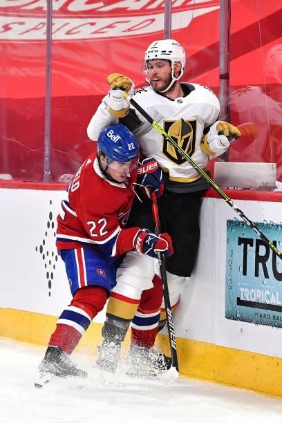 Brayden McNabb of the Vegas Golden Knights is checked into the boards by Cole Caufield of the Montreal Canadiens during the third period in Game...