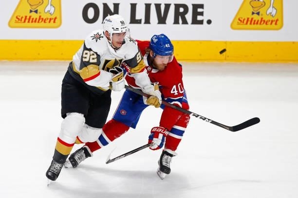 Tomas Nosek of the Vegas Golden Knights and Joel Armia of the Montreal Canadiens battle for the puck during the first period in Game Three of the...
