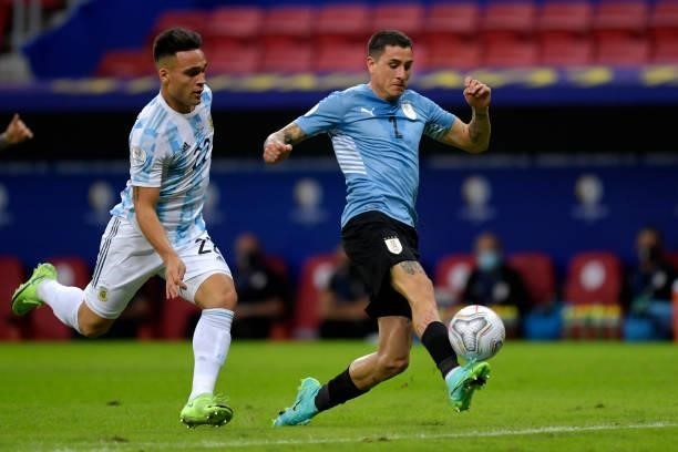 Jose Gimenez of Uruguay controls the ball against Lautaro Martinez of Argentina during a group A match between Argentina and Chile as part of...
