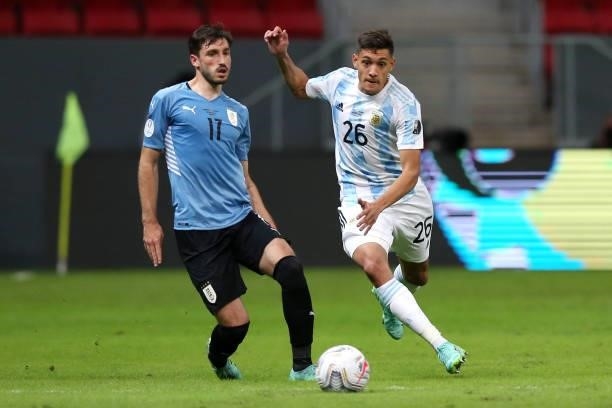 Nahuel Molina of Argentina and Matias Viña of Uruguay compete for the ball during a group A match between Argentina and Chile as part of Conmebol...