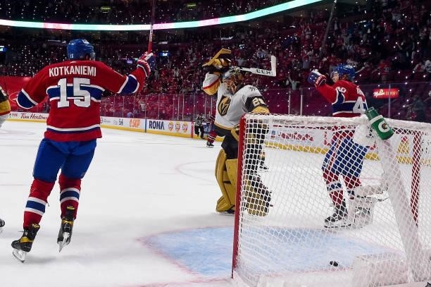 Jesperi Kotkaniemi and Joel Armia of the Montreal Canadiens celebrate a goal by teammate Josh Anderson past Marc-Andre Fleury of the Vegas Golden...