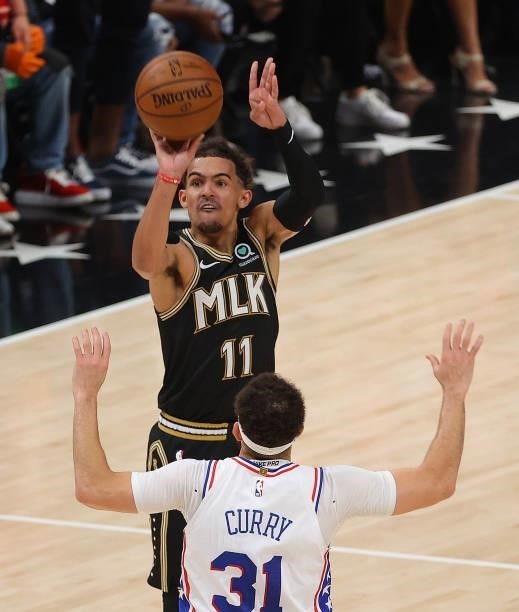 Trae Young of the Atlanta Hawks shoots a three-point basket against Seth Curry of the Philadelphia 76ers during the second half of game 6 of the...