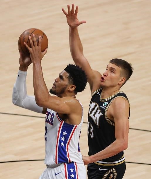 Tobias Harris of the Philadelphia 76ers attacks the basket against Bogdan Bogdanovic of the Atlanta Hawks during the first half of game 6 of the...