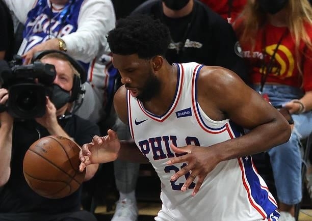 Joel Embiid of the Philadelphia 76ers attempts a steal against the Atlanta Hawks during the first half of game 6 of the Eastern Conference Semifinals...