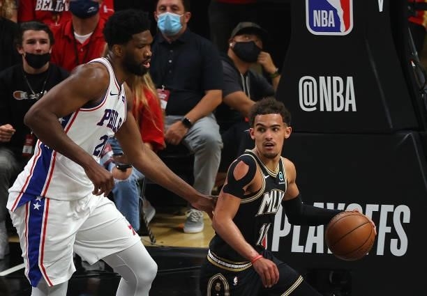 Trae Young of the Atlanta Hawks drives against Joel Embiid of the Philadelphia 76ers during the first half of game 6 of the Eastern Conference...