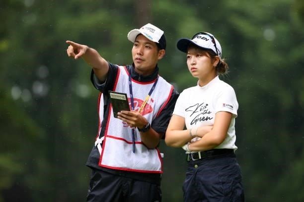 Hikari Tanabe of Japan discusses with her caddie on the 8th tee during the second round of Nichirei Ladies at Sodegaura Country Club Shinsode Course...
