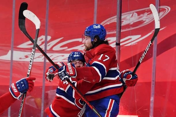 Josh Anderson of the Montreal Canadiens is congratulated by Paul Byron after scoring the game-winning goal against the Vegas Golden Knights during...