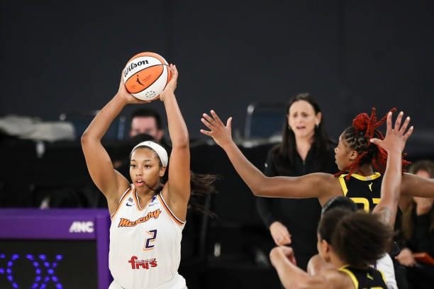 Forward Megan Walker of the Phoenix Mercury looks to pass the ball defended by guard Bria Holmes of the Los Angeles Sparks at Los Angeles Convention...