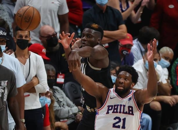 Clint Capela of the Atlanta Hawks knocks the ball away from Joel Embiid of the Philadelphia 76ers during the second half of game 6 of the Eastern...
