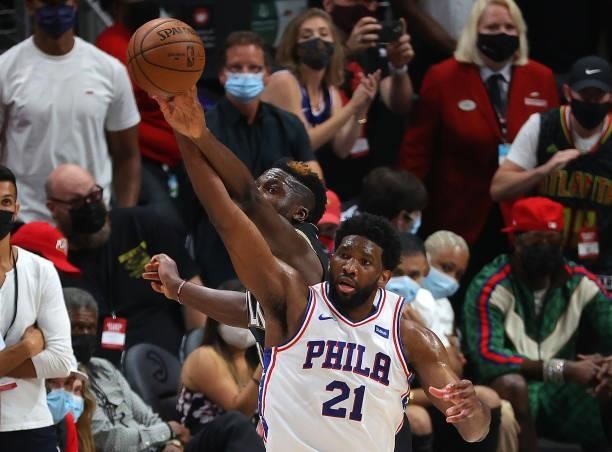 Clint Capela of the Atlanta Hawks knocks the ball away from Joel Embiid of the Philadelphia 76ers during the second half of game 6 of the Eastern...