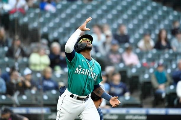 Shed Long Jr. #4 of the Seattle Mariners reacts as he walks to first base during the game against the Tampa Bay Rays at T-Mobile Park on June 18,...