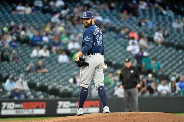 Andrew Kittredge of the Tampa Bay Rays eyes the first base runner during the game against the Seattle Mariners at T-Mobile Park on June 18, 2021 in...