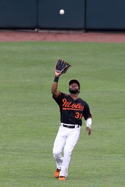 Cedric Mullins of the Baltimore Orioles makes a catch against the Toronto Blue Jays at Oriole Park at Camden Yards on June 18, 2021 in Baltimore,...