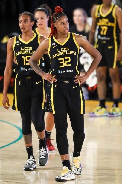 Guard Bria Holmes and guard Brittney Sykes of the Los Angeles Sparks react during the second half against the Phoenix Mercury at Los Angeles...