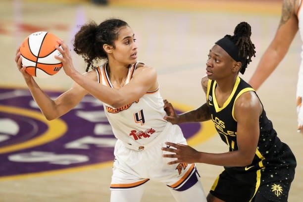 Guard Skylar Diggins-Smith of the Phoenix Mercury handles the ball defended by guard Erica Wheeler of the Los Angeles Sparks at Los Angeles...