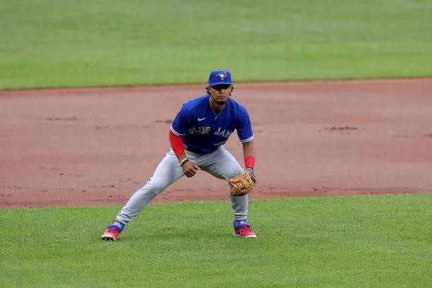 Third baseman Santiago Espinal of the Toronto Blue Jays follows the ball against the Baltimore Orioles at Oriole Park at Camden Yards on June 18,...
