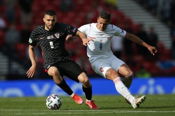 Mateo Kovacic of Croatia is closed down by Tomas Holes of Czech Republic during the UEFA Euro 2020 Championship Group D match between Croatia and...
