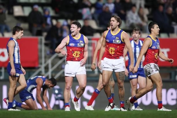 Lachie Neale of the Lions celebrates with team mates after kicking a goal during the round 14 AFL match between the North Melbourne Kangaroos and the...