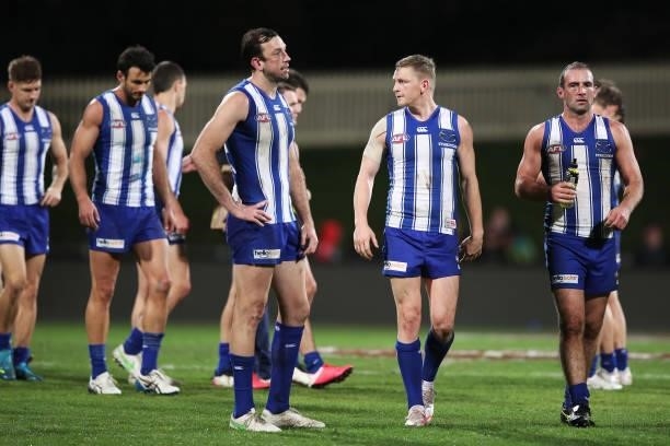 Jack Ziebell and Ben Cunnington of the Kangaroos look dejected after the round 14 AFL match between the North Melbourne Kangaroos and the Brisbane...