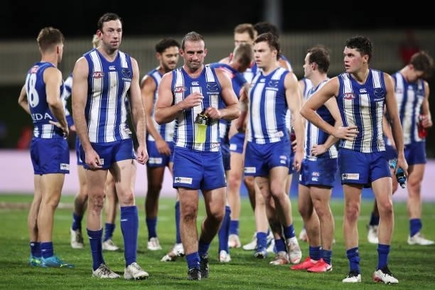 Todd Goldstein and Ben Cunnington of the Kangaroos look dejected after the round 14 AFL match between the North Melbourne Kangaroos and the Brisbane...