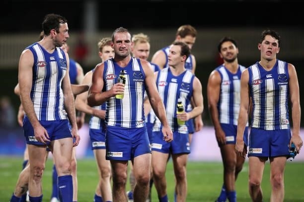 Todd Goldstein and Ben Cunnington of the Kangaroos look dejected after the round 14 AFL match between the North Melbourne Kangaroos and the Brisbane...
